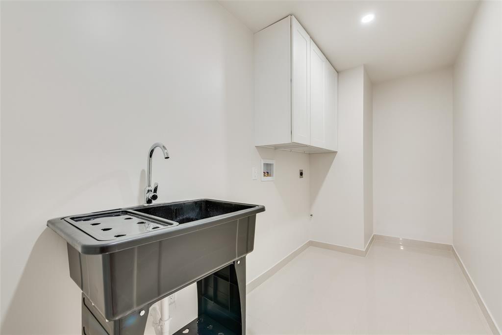 3106 Sharpview Lane Dallas, TX 75228 - Photo 15 of 33 a kitchen with a sink and cabinets