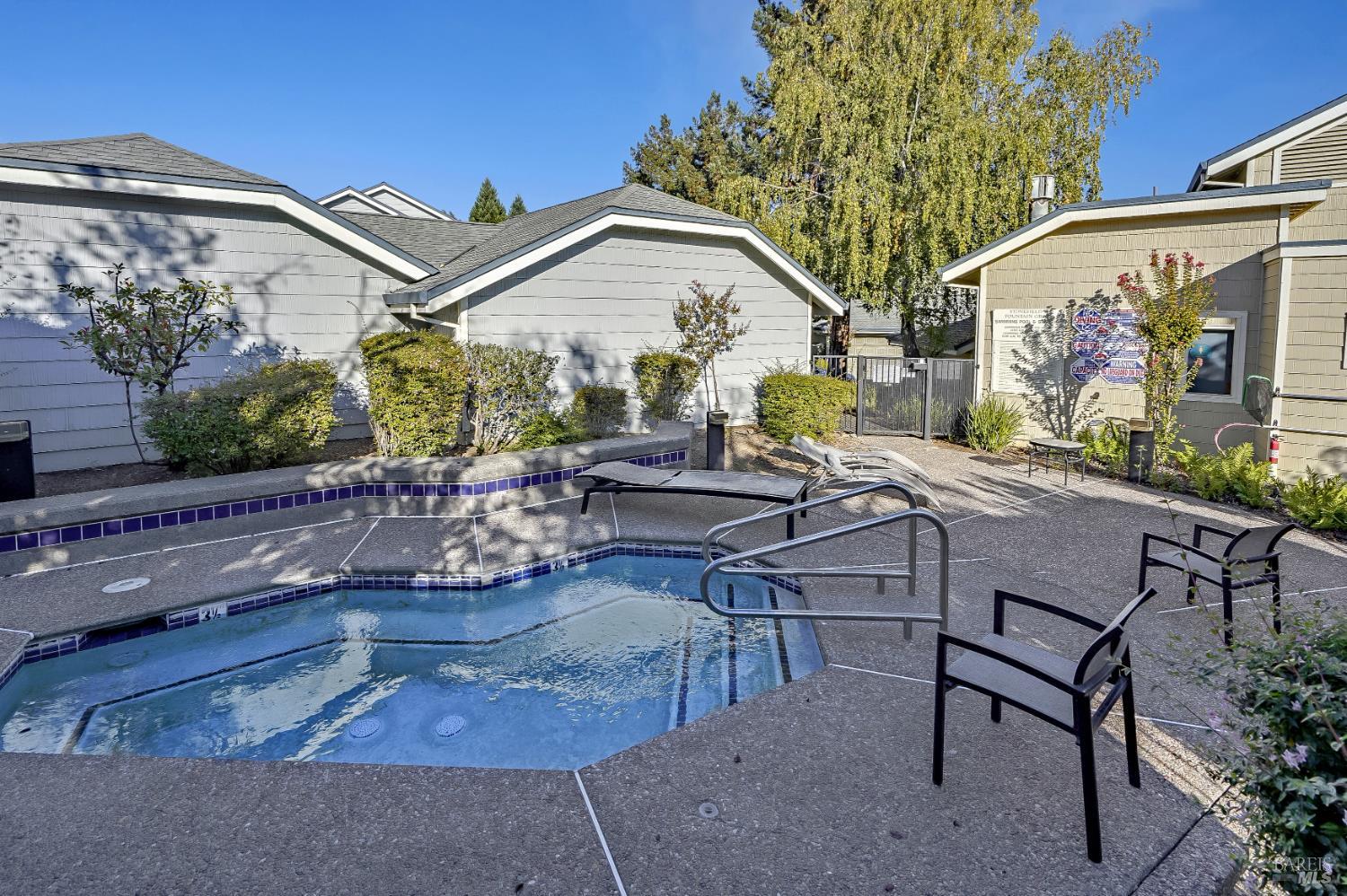 2092 Stonefield Lane Santa Rosa, CA 95403 - Photo 40 of 44 a view of a patio with table and chairs and potted plants