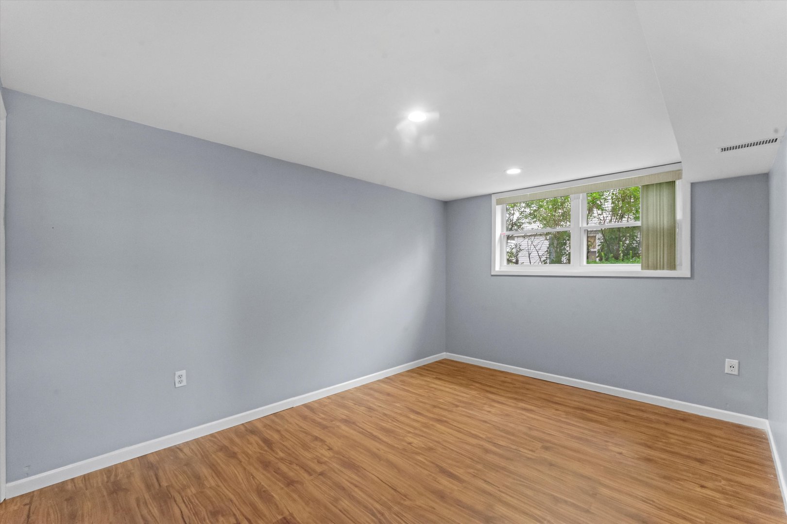 300 Hemlock Avenue Romeoville, IL 60446 - Photo 14 of 31 a view of empty room with wooden floor and fan