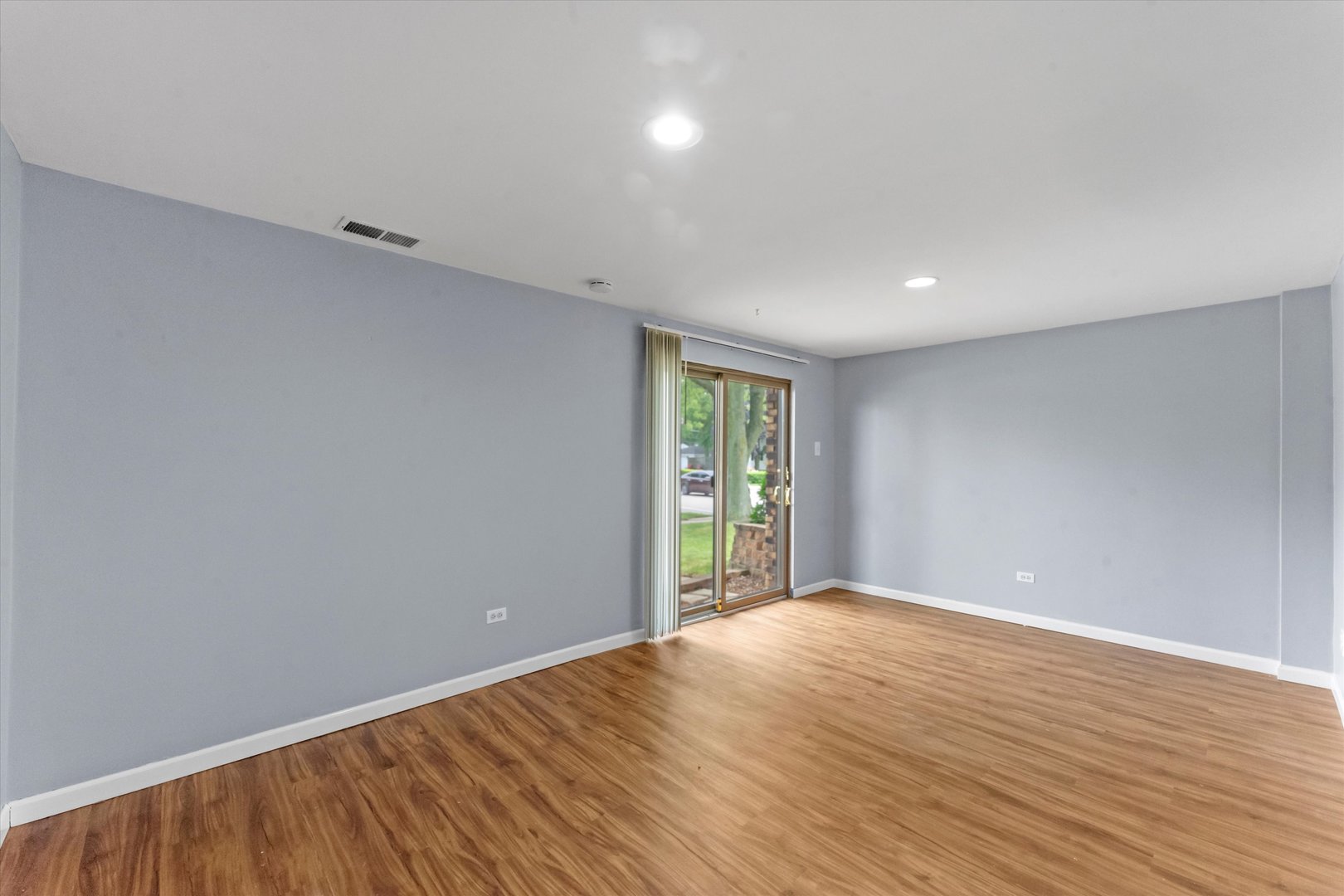 300 Hemlock Avenue Romeoville, IL 60446 - Photo 16 of 31 wooden floor in an empty room with a window