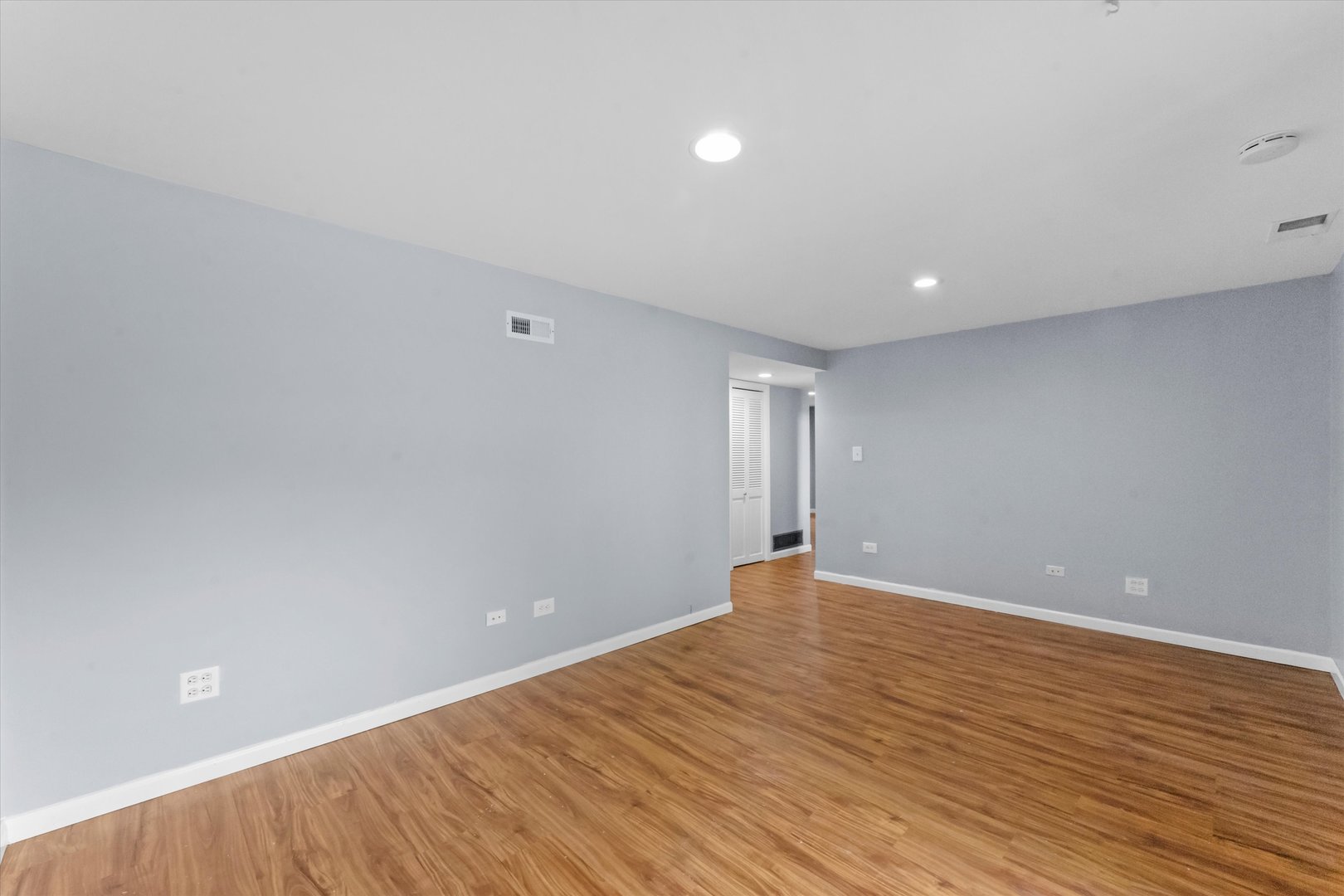 300 Hemlock Avenue Romeoville, IL 60446 - Photo 18 of 31 a view of an empty room with wooden floor
