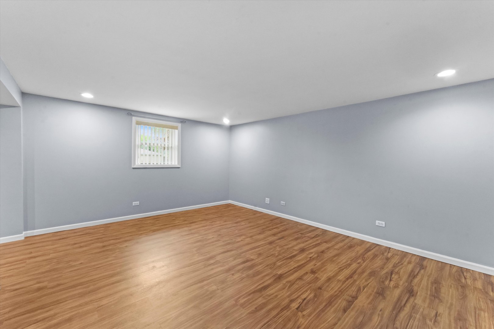 300 Hemlock Avenue Romeoville, IL 60446 - Photo 19 of 31 a view of an empty room with wooden floor and a window