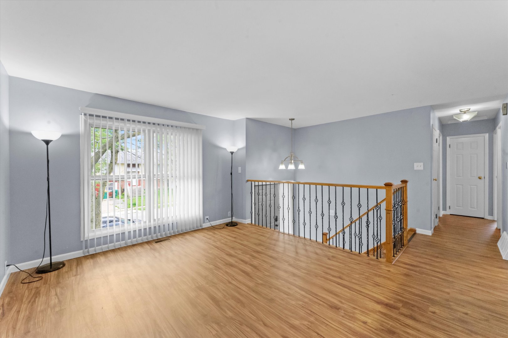 300 Hemlock Avenue Romeoville, IL 60446 - Photo 4 of 31 a view of an empty room with wooden floor and a window