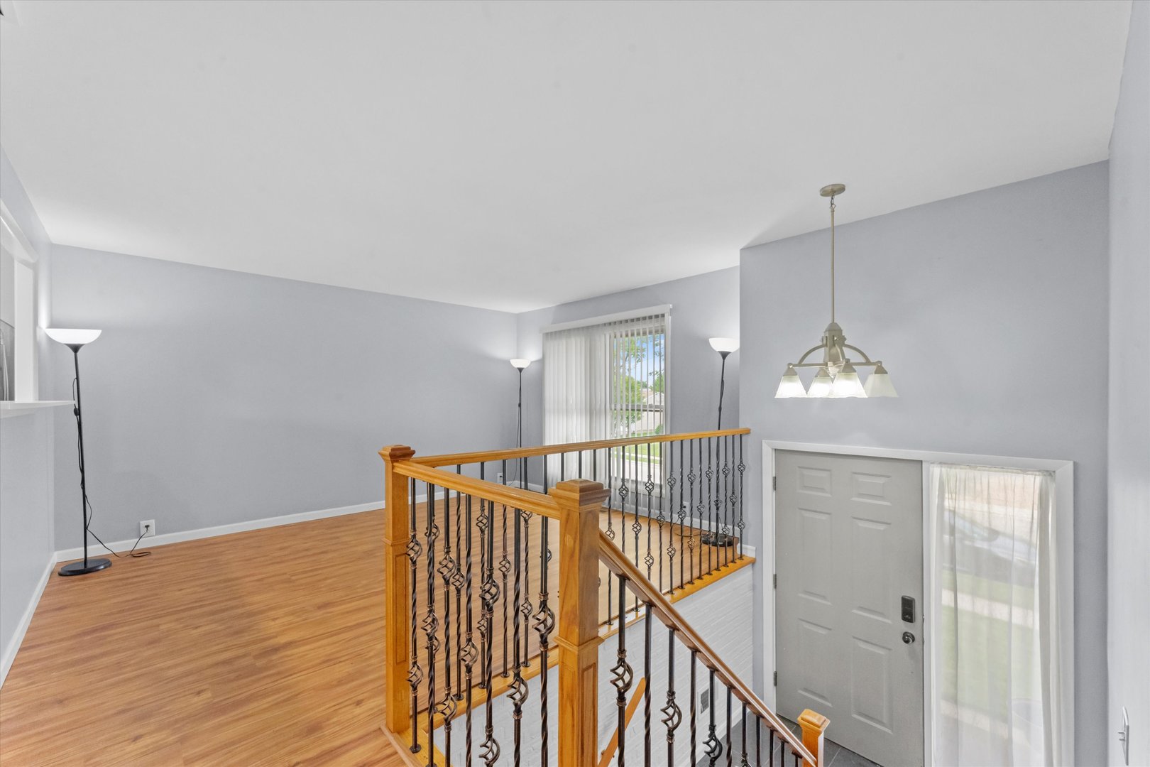 300 Hemlock Avenue Romeoville, IL 60446 - Photo 8 of 31 a view of an entryway with wooden floor