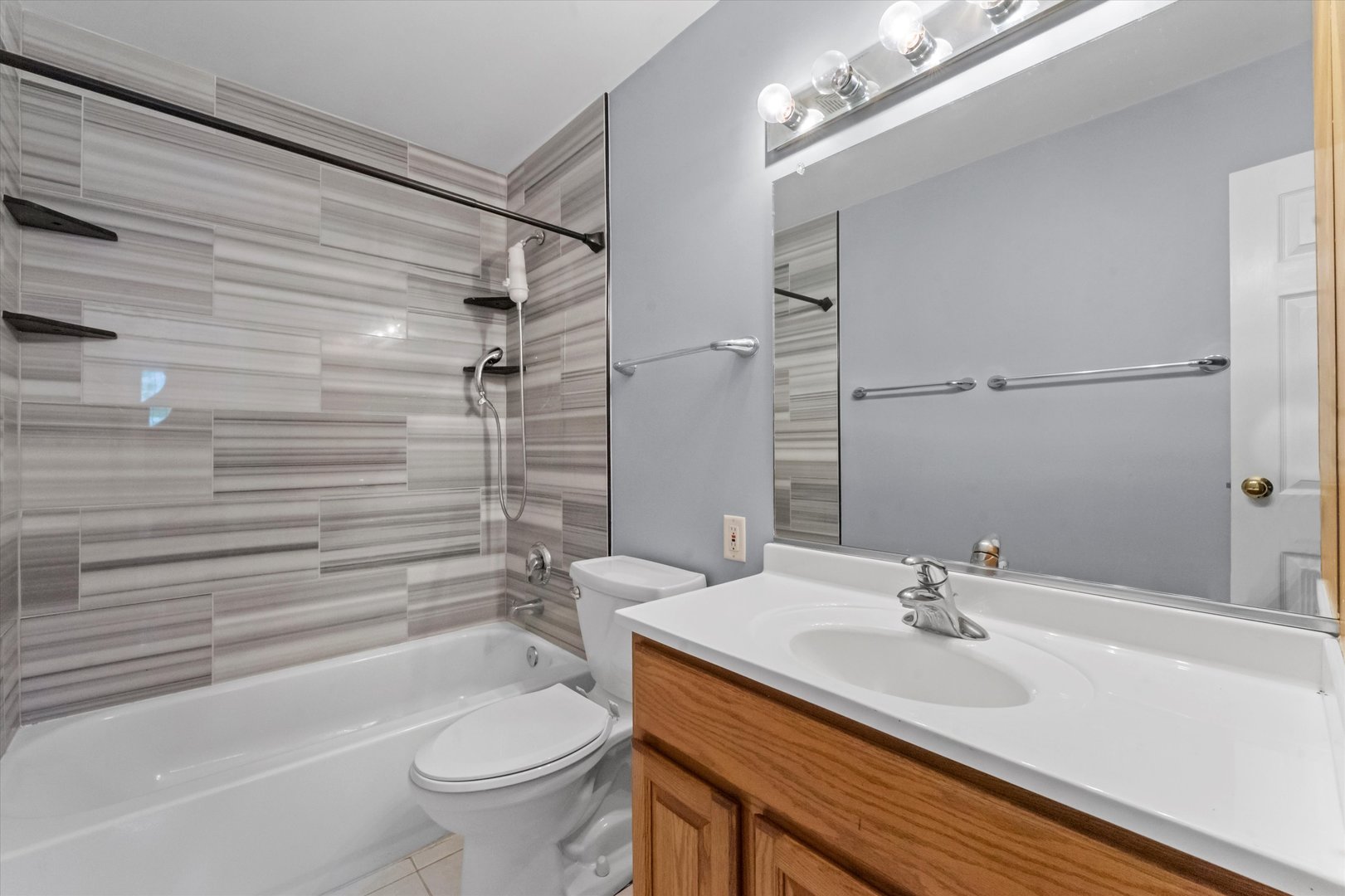 300 Hemlock Avenue Romeoville, IL 60446 - Photo 9 of 31 a bathroom with a sink a toilet and shower