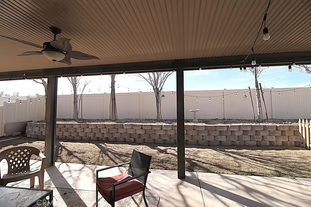 924 Condor Street Barstow, CA 92311 - Photo 46 of 52 a view of a patio with table and chairs and wooden floor