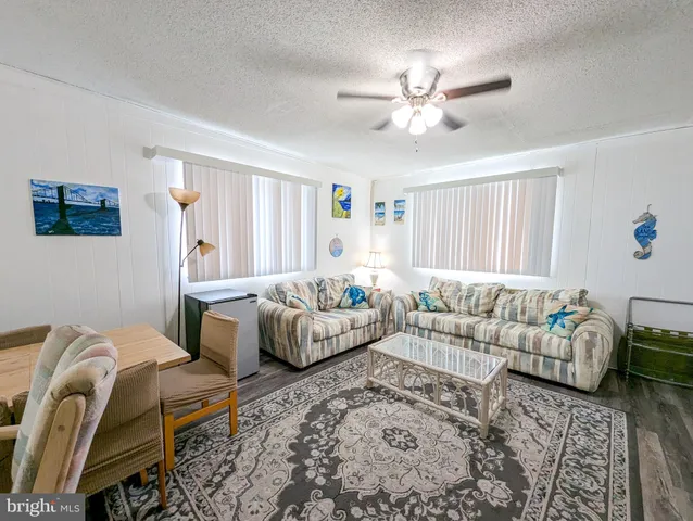 a bedroom with a bed and ceiling fan