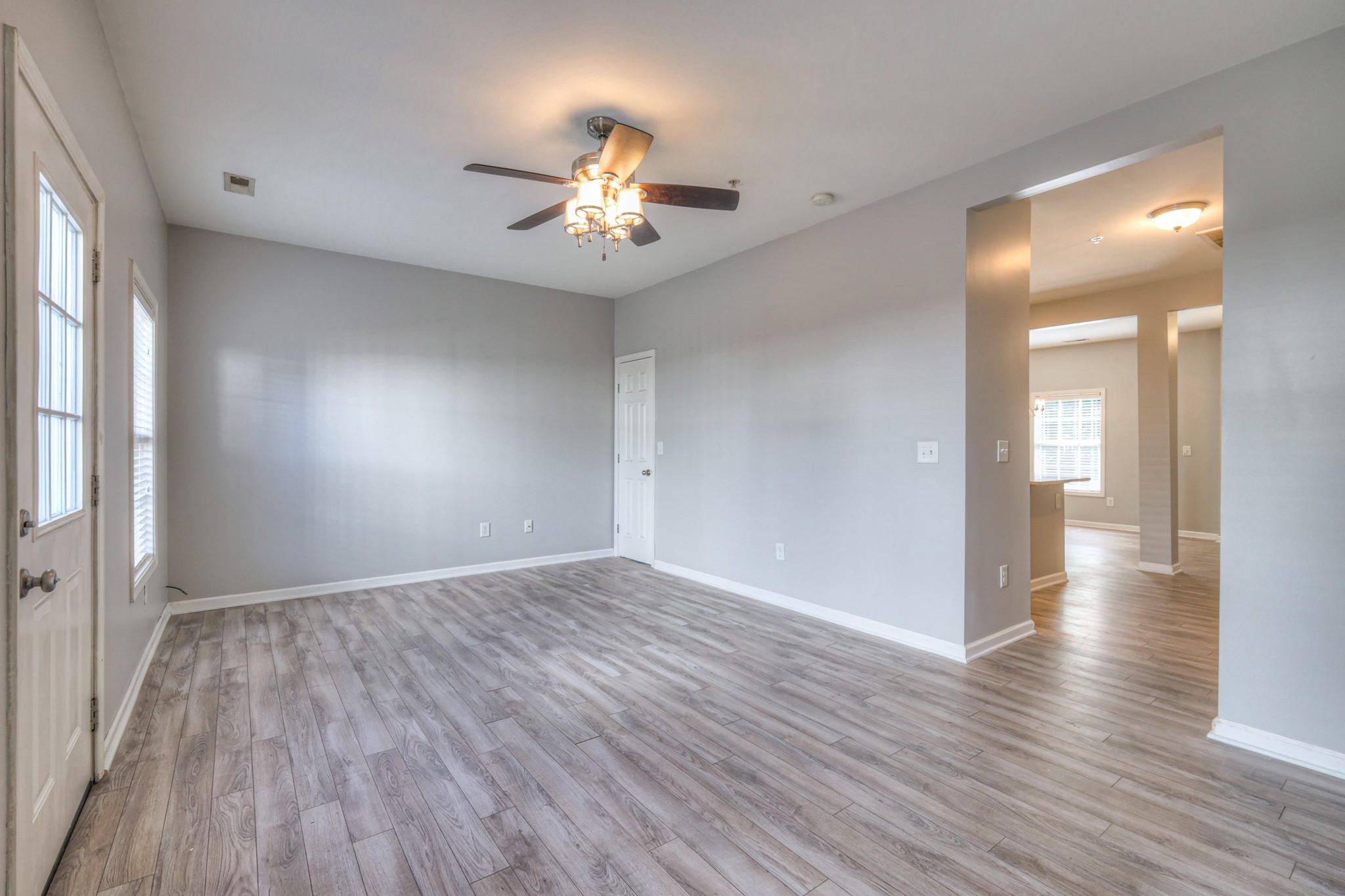 4027 Clinton Lane Spring Hill, TN 37174 - Photo 5 of 25 an empty room with wooden floor and windows