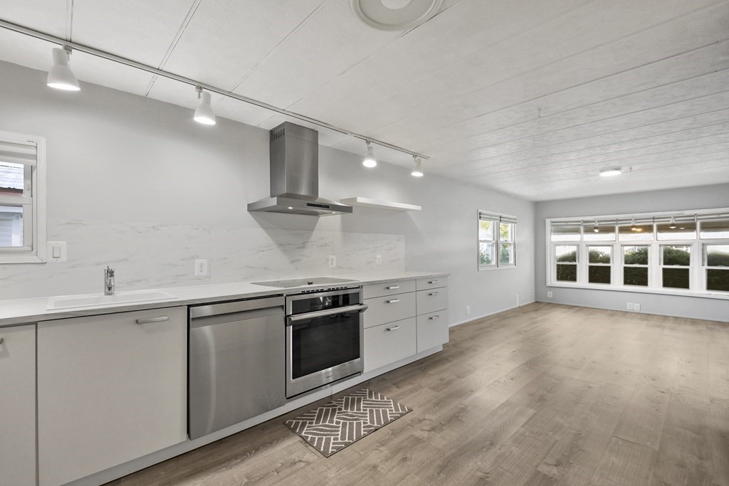 40 Eldorado Drive Marlborough, MA 01752 - Photo 12 of 26 a large kitchen with stainless steel appliances granite countertop a sink and a stove