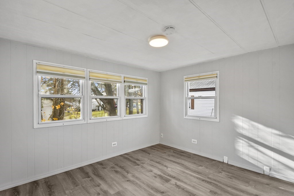 40 Eldorado Drive Marlborough, MA 01752 - Photo 17 of 26 a view of an empty room with a window and wooden floor