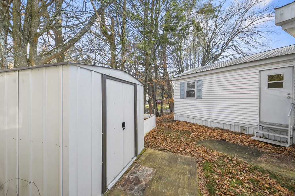 40 Eldorado Drive Marlborough, MA 01752 - Photo 23 of 26 a backyard of a house with a large tree