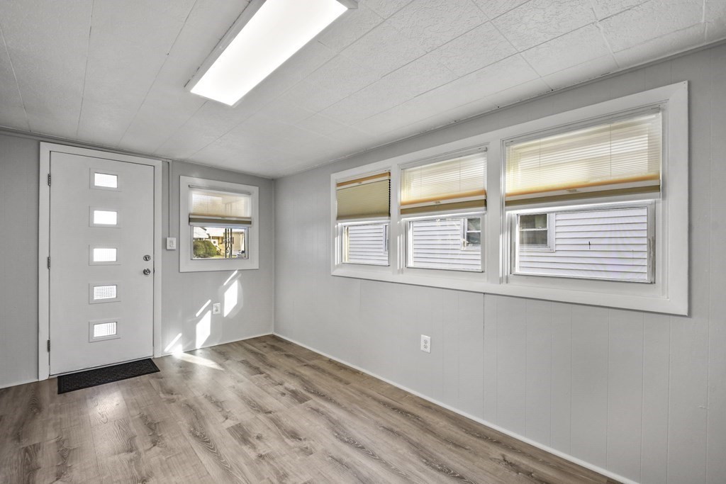 40 Eldorado Drive Marlborough, MA 01752 - Photo 4 of 26 a view of empty room with window and wooden floor