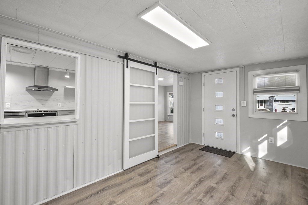 40 Eldorado Drive Marlborough, MA 01752 - Photo 5 of 26 a view of empty room with wooden floor and cabinet