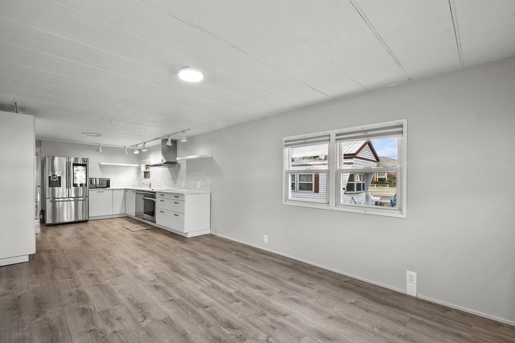 40 Eldorado Drive Marlborough, MA 01752 - Photo 6 of 26 a view of a kitchen with wooden floor and a sink