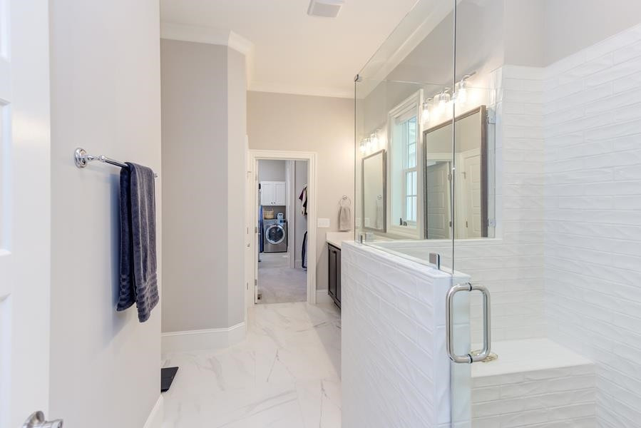 1017 Bradburn Drive Durham, NC 27713 - Photo 17 of 34 a bathroom with a double vanity sink mirror and shower