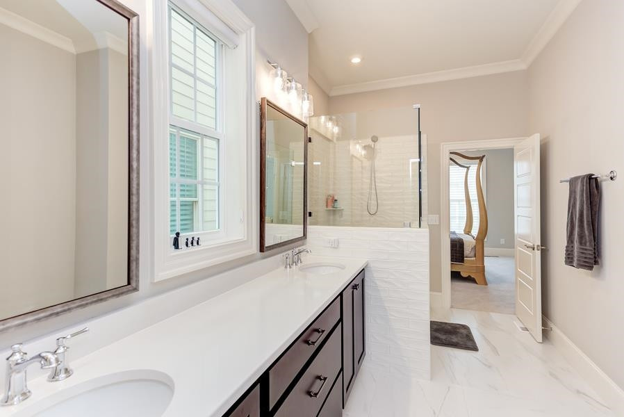 1017 Bradburn Drive Durham, NC 27713 - Photo 19 of 34 a bathroom with a sink and a mirror