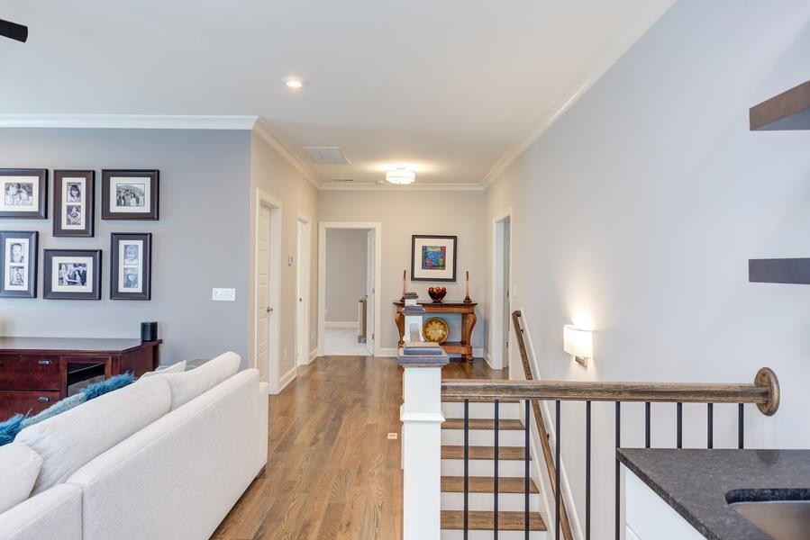 1017 Bradburn Drive Durham, NC 27713 - Photo 21 of 34 a living room with furniture and a wooden floor