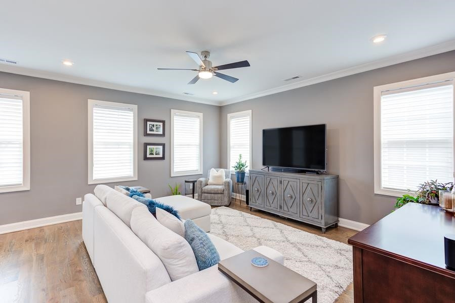 1017 Bradburn Drive Durham, NC 27713 - Photo 23 of 34 a living room with furniture and a flat screen tv