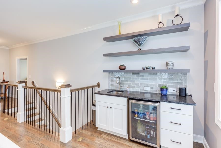 1017 Bradburn Drive Durham, NC 27713 - Photo 25 of 34 a kitchen with stainless steel appliances granite countertop a sink and cabinets