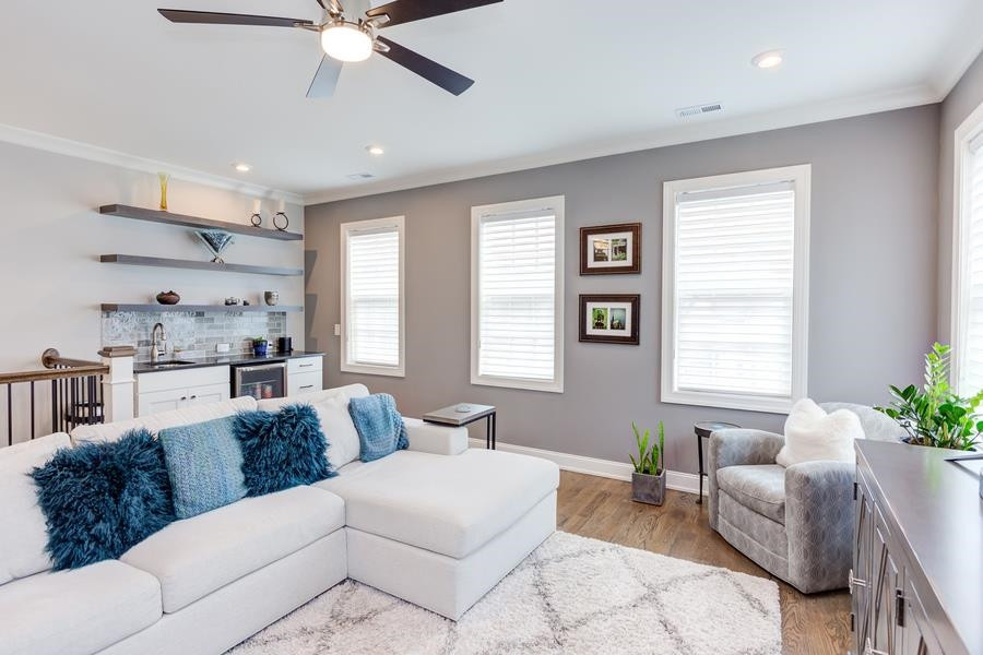 1017 Bradburn Drive Durham, NC 27713 - Photo 26 of 34 a living room with furniture and a large window
