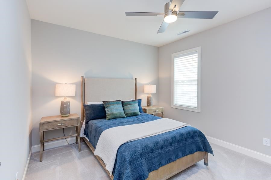 1017 Bradburn Drive Durham, NC 27713 - Photo 27 of 34 a bedroom with a bed and window