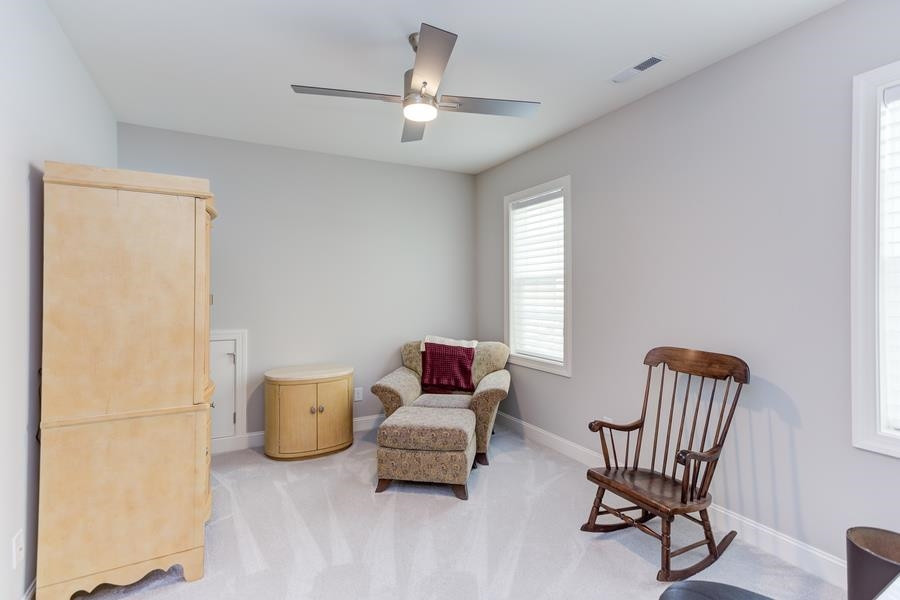 1017 Bradburn Drive Durham, NC 27713 - Photo 28 of 34 a living room with furniture and a window