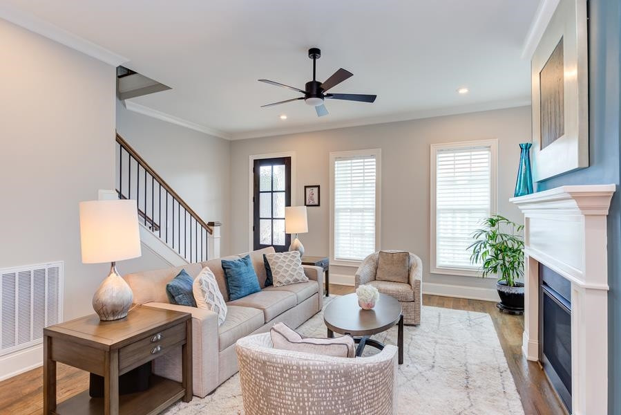 1017 Bradburn Drive Durham, NC 27713 - Photo 4 of 34 a living room with furniture potted plant and a window