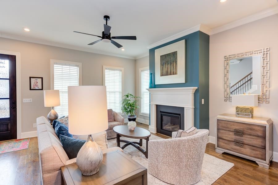 1017 Bradburn Drive Durham, NC 27713 - Photo 5 of 34 a living room with furniture and a fireplace