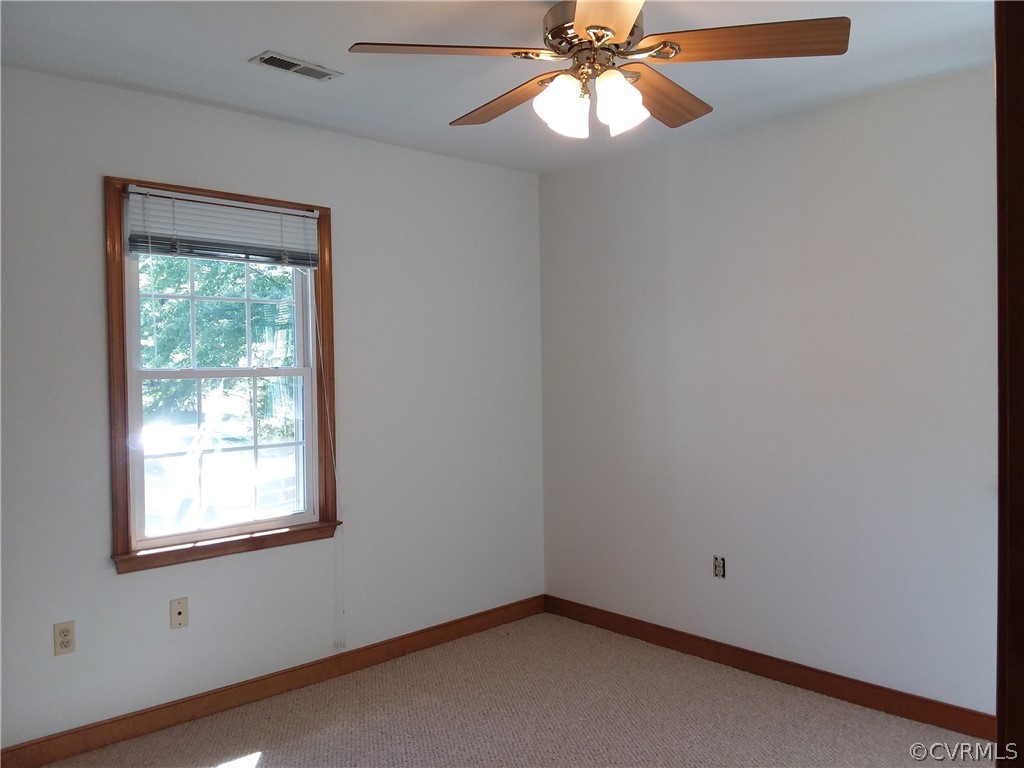5302 Ridgerun Place Chesterfield, VA 23832 - Photo 5 of 16 an empty room with a window and a fan