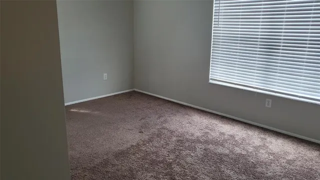 a view of a room that has a window in it