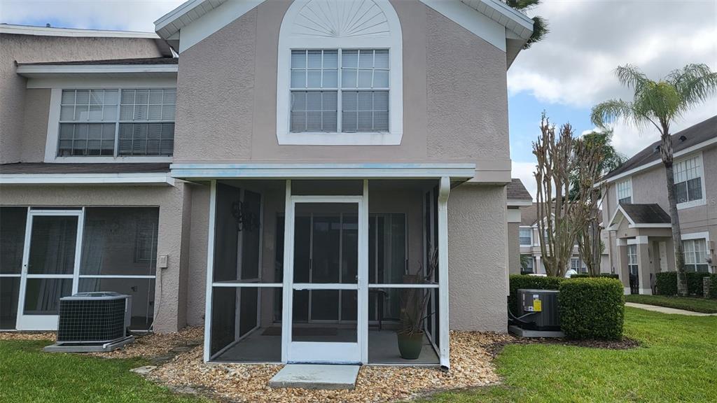 721 Kensington Lake Circle Brandon, FL 33511 - Photo 14 of 15 a view of brick house with a large windows and a yard