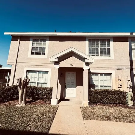a view of a house with a small yard