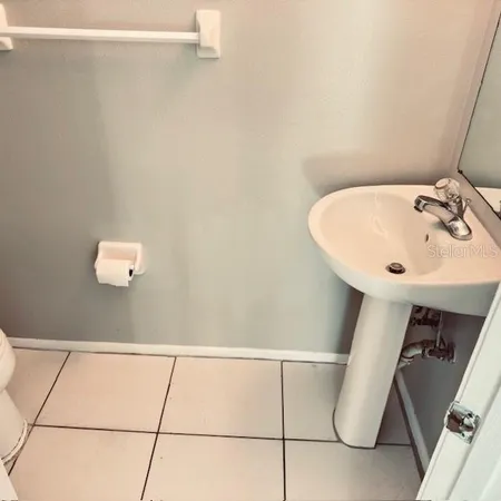 a bathroom with a sink and mirror