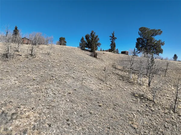 a view of ocean with a building in the background