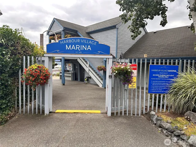 a view of a house with wooden fence