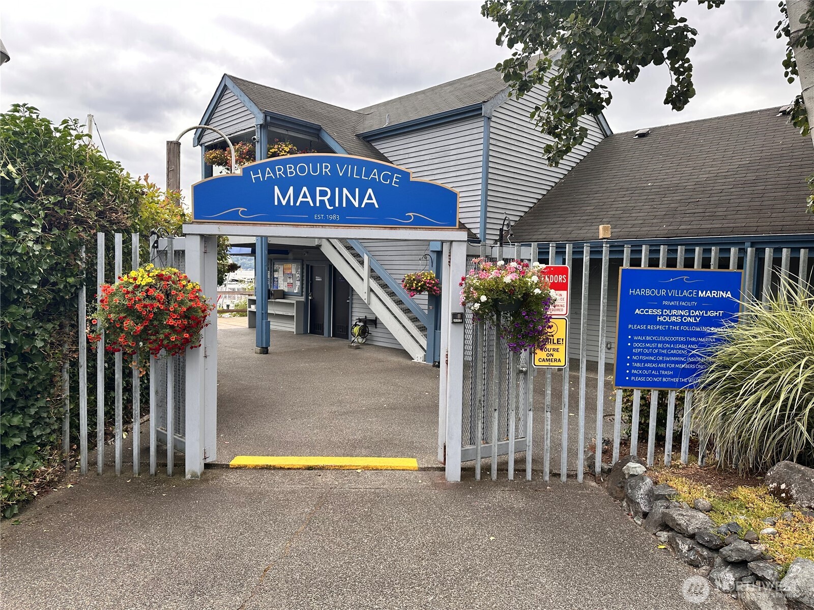 6155 Northeast 175th Street, Unit 227 Kenmore, WA 98028 - Photo 2 of 14 a view of a house with wooden fence