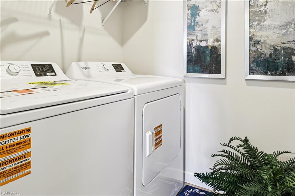 8022 Cedar Ky Way Lehigh Acres, FL 33971 - Photo 26 of 45 a utility room with dryer and washer