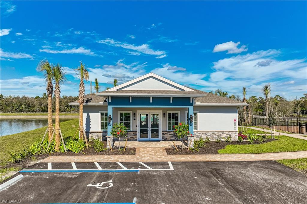 8022 Cedar Ky Way Lehigh Acres, FL 33971 - Photo 29 of 45 a front view of a house with a yard