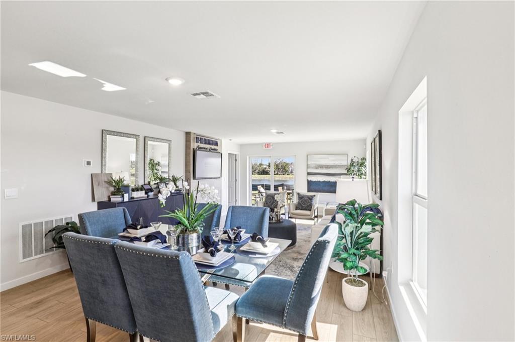 8022 Cedar Ky Way Lehigh Acres, FL 33971 - Photo 8 of 45 a view of a dining room with furniture window and outside view