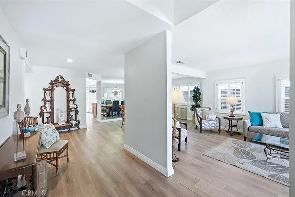 a kitchen with stainless steel appliances granite countertop wooden cabinets and a sink