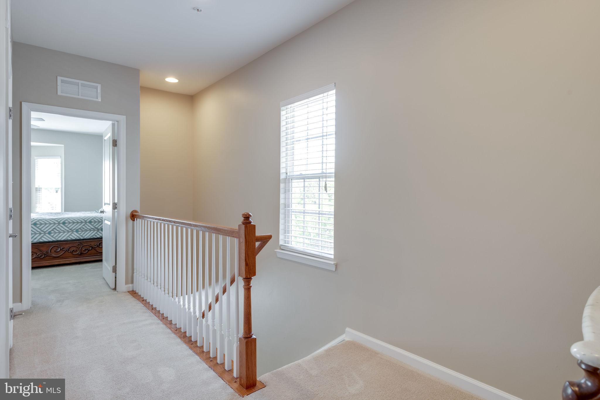 7450 Brunson Circle Gainesville, VA 20155 - Photo 16 of 39 Upper level landing/hall to master bedroom