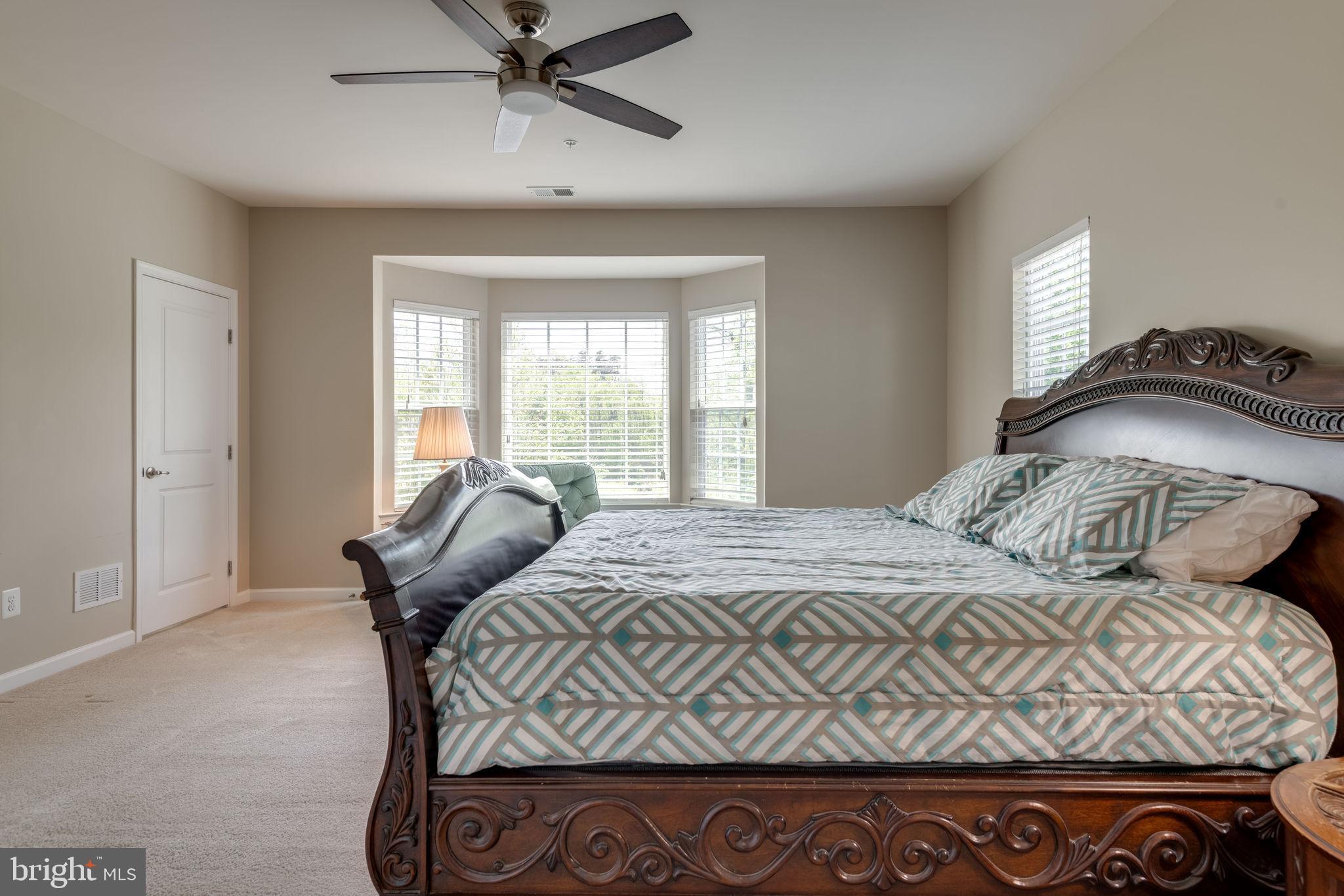 7450 Brunson Circle Gainesville, VA 20155 - Photo 17 of 39 Sunny master bedroom w/bay window