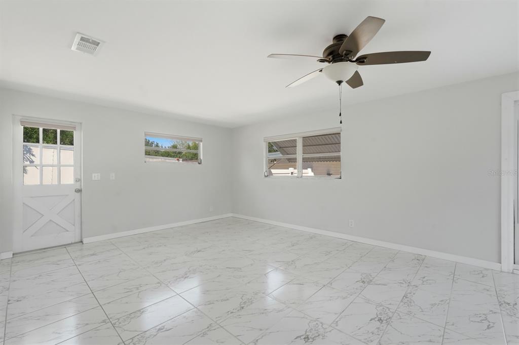 231 North Ridgewood Avenue Ormond Beach, FL 32174 - Photo 14 of 52 a view of an empty room with a window