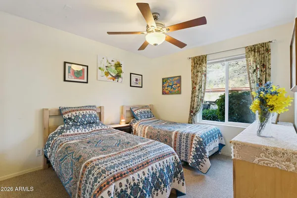 a living room with furniture and a sink