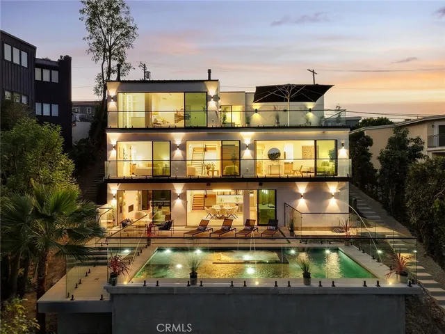 a view of a swimming pool with an outdoor seating