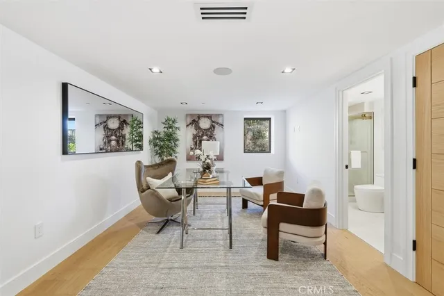 a spacious bedroom with a large bed and a couch