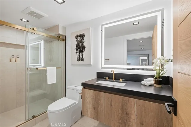 a bed room with a bed and a potted plant