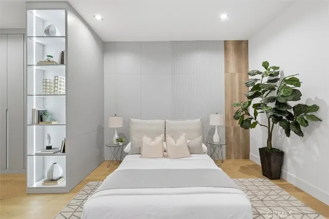 a bathroom with a double vanity sink a mirror and a bathtub