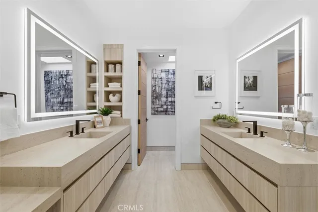 a utility room with sink dryer and washer