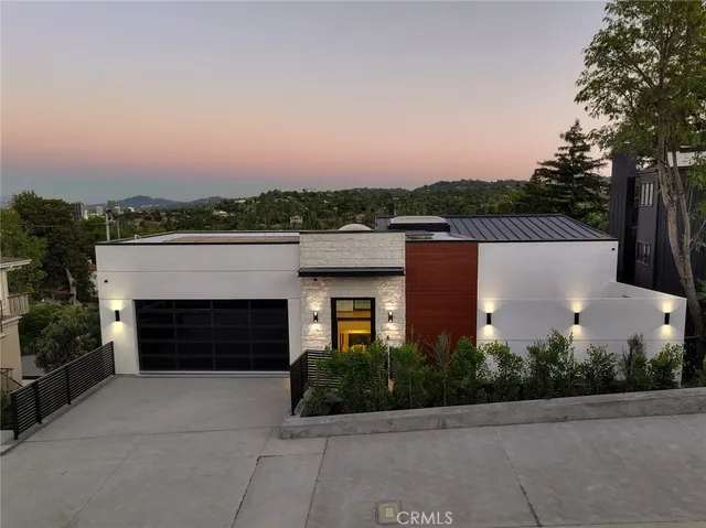 an outdoor view of house with yard and parking